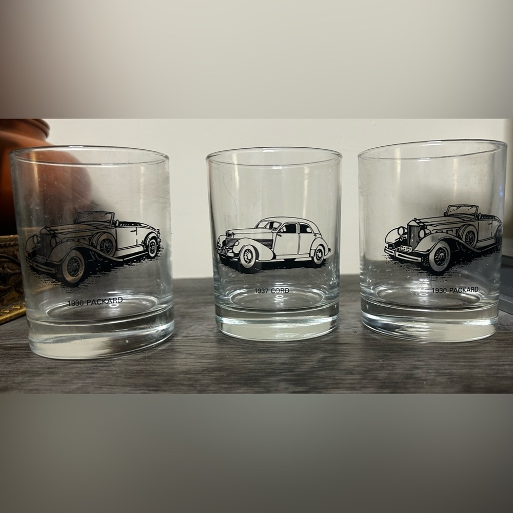 Set of three vintage classic car glasses.